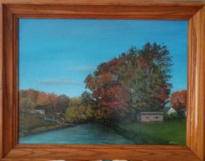 Northeast Canal, framed acrylic painting by ASPIE artist David Allen of a canal in autumn with red and gold trees and small buildings